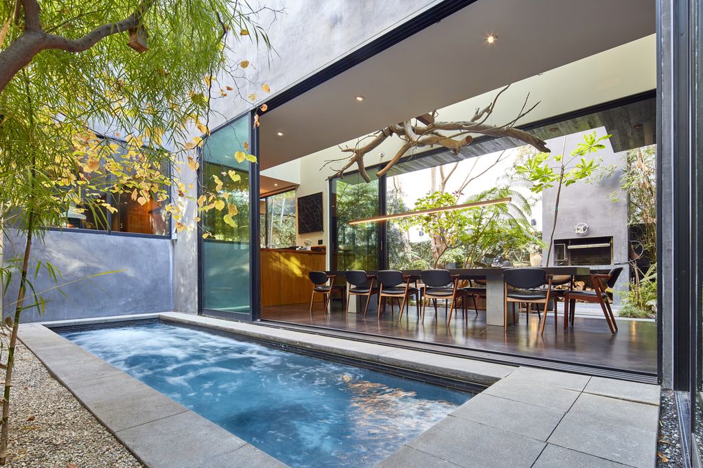 The Home in Venice is a custom-built Marmol Radziner with a pool that infuses cutting-edge style with warmth in an intimate and sultry setting now available for sale. This home located at 730 Palms Blvd, Venice, California