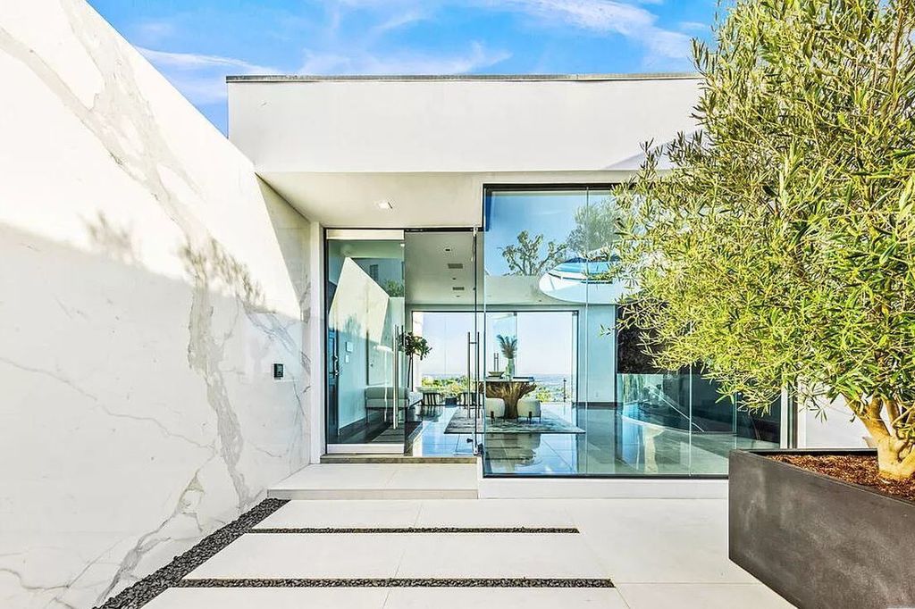 The Home in Beverly Hills is the Crown Jewel of Beverly Crest offering stunning panoramic views from Downtown LA to the Pacific year-round now available for sale. This home located at 9374 Beverly Crest Dr, Beverly Hills, California