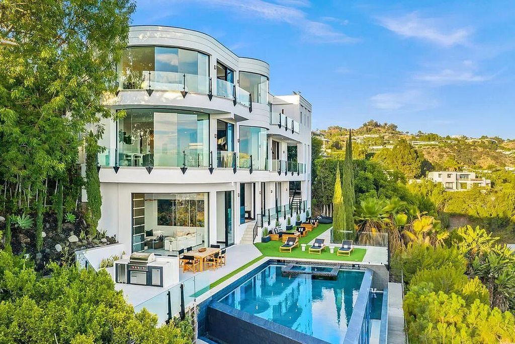 The Home in Beverly Hills is the Crown Jewel of Beverly Crest offering stunning panoramic views from Downtown LA to the Pacific year-round now available for sale. This home located at 9374 Beverly Crest Dr, Beverly Hills, California