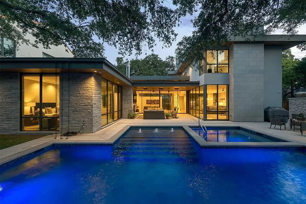The Home in Dallas is a modern architectural gem has stunning interiors transition seamlessly to the covered outdoor back patio now available for sale. This home located at 5309 Wenonah Dr, Dallas, Texas