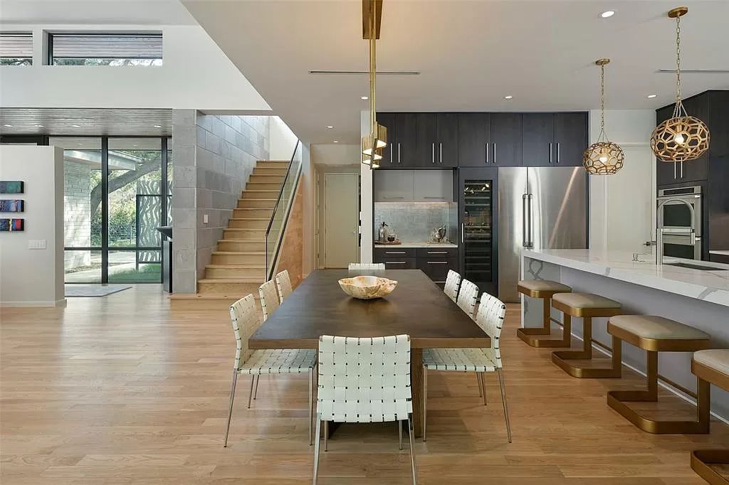 The Home in Dallas is a modern architectural gem has stunning interiors transition seamlessly to the covered outdoor back patio now available for sale. This home located at 5309 Wenonah Dr, Dallas, Texas