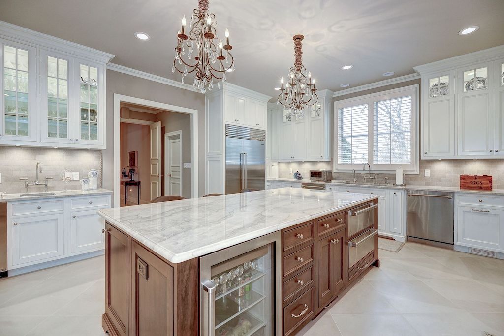 The Home in Virginia is a luxurious home constructed of brick and cast stone now available for sale. This home located at 1198 Windrock Dr, Mc Lean, Virginia; offering 07 bedrooms and 09 bathrooms with 10,886 square feet of living spaces.