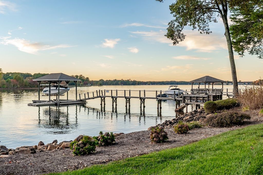 The Home in North Carolina is a luxurious home capturing magnificent views of Lake Norman now available for sale. This home located at 8343 Norman Estates Dr, Denver, North Carolina; offering 05 bedrooms and 07 bathrooms with 8,094 square feet of living spaces. 