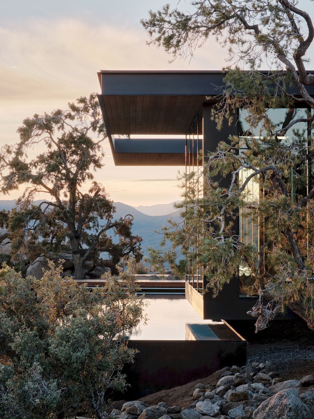 High Desert Retreat Surrounded by Rocks & Trees by Aidlin Darling Design