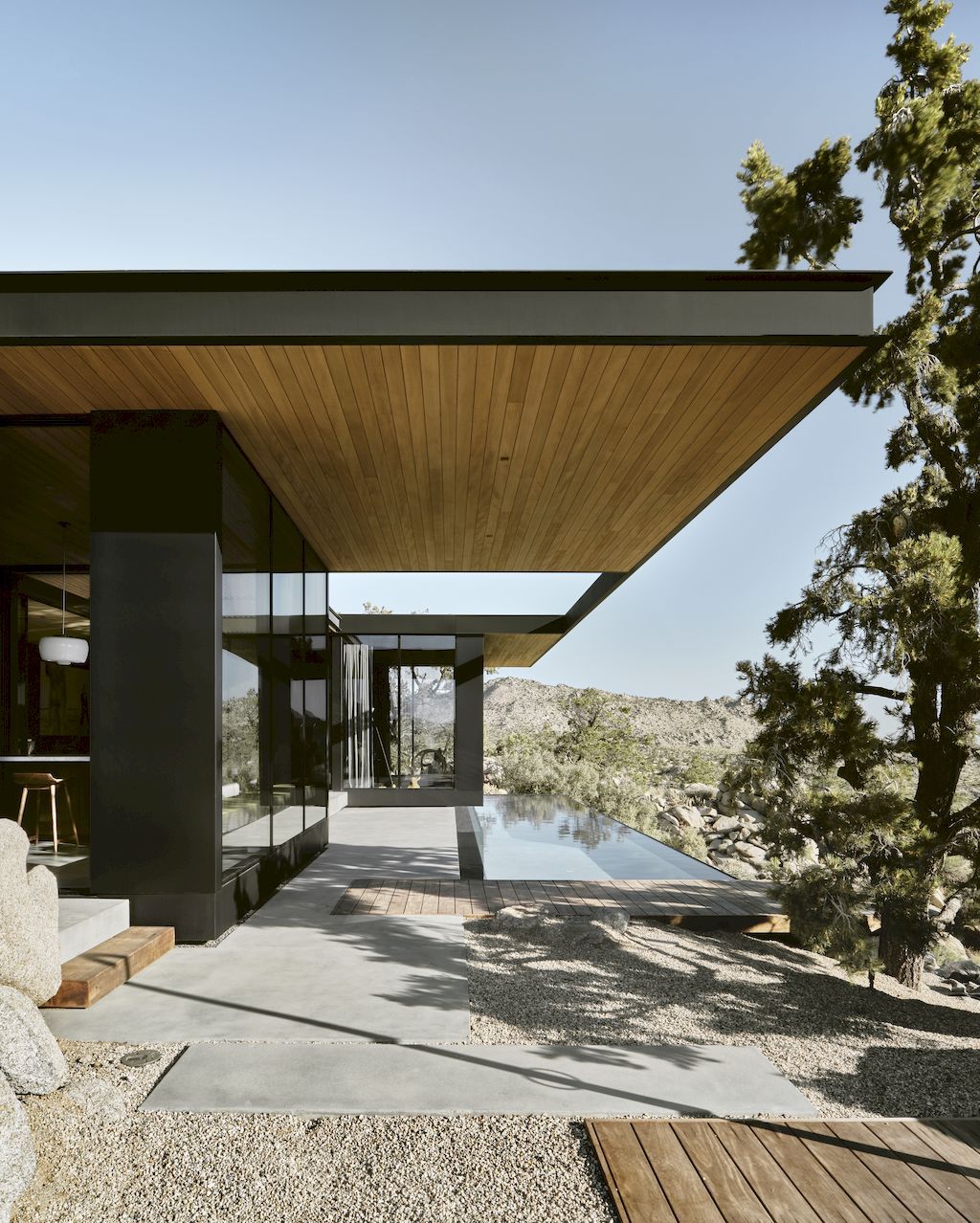 High Desert Retreat Surrounded by Rocks & Trees by Aidlin Darling Design