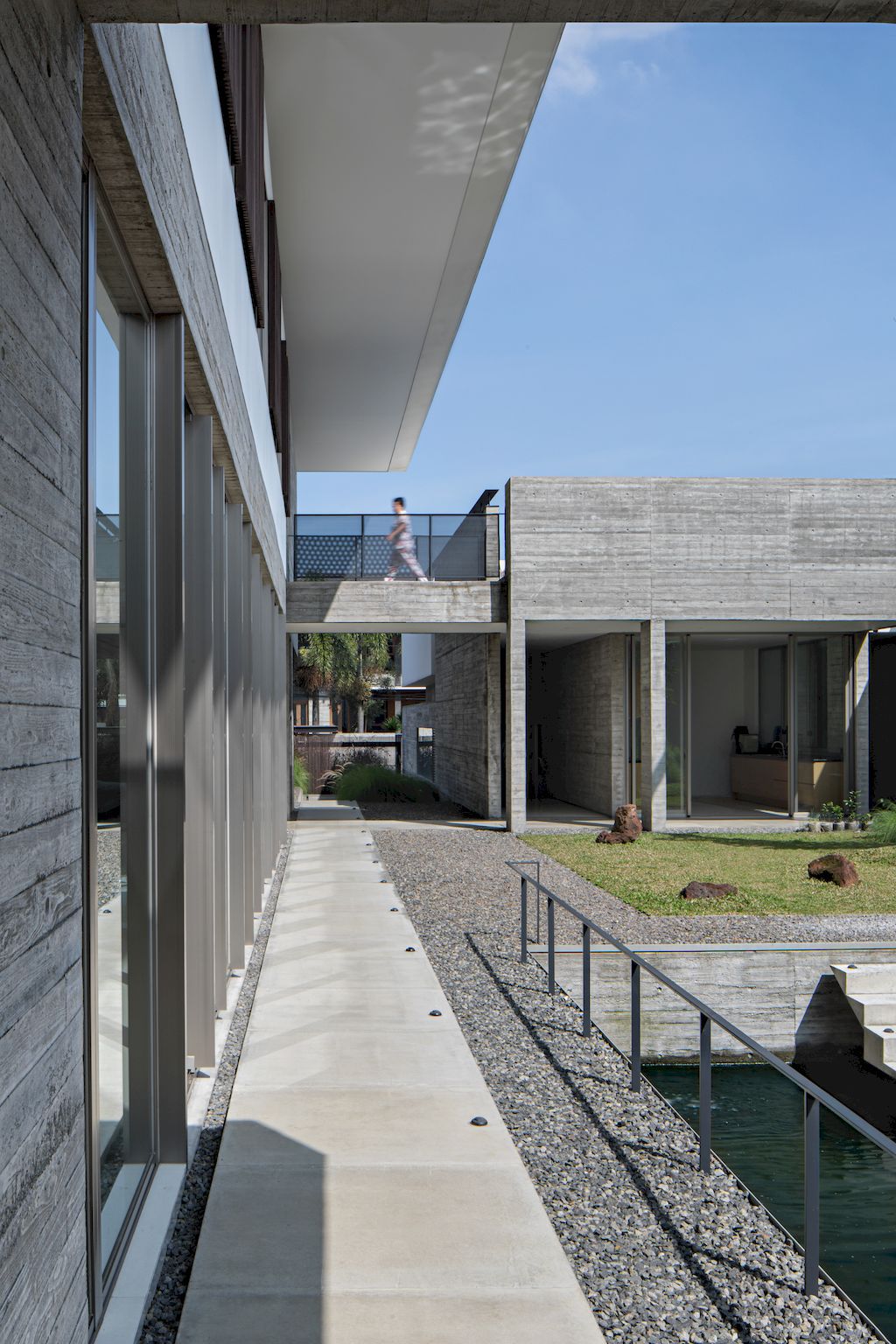 Hover-House-with-rustic-brutal-of-concrete-Design-by-Pranala-Associates-10