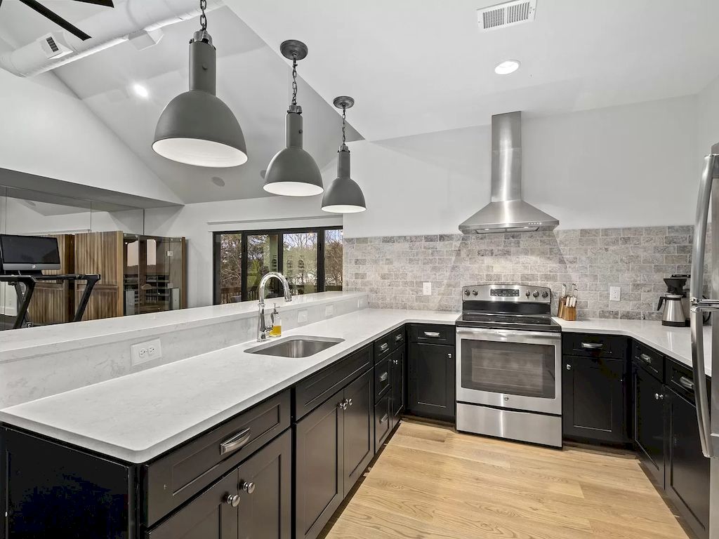 One of the most defining characteristics of an industrial kitchen is the use of metal finishes. Stainless steel, brushed nickel, and chrome are all popular choices for industrial kitchen design. You can incorporate metal finishes into your kitchen by using stainless steel appliances, faucets, and lighting fixtures. Metal shelving and racks can also be used to add storage and visual interest to your space.