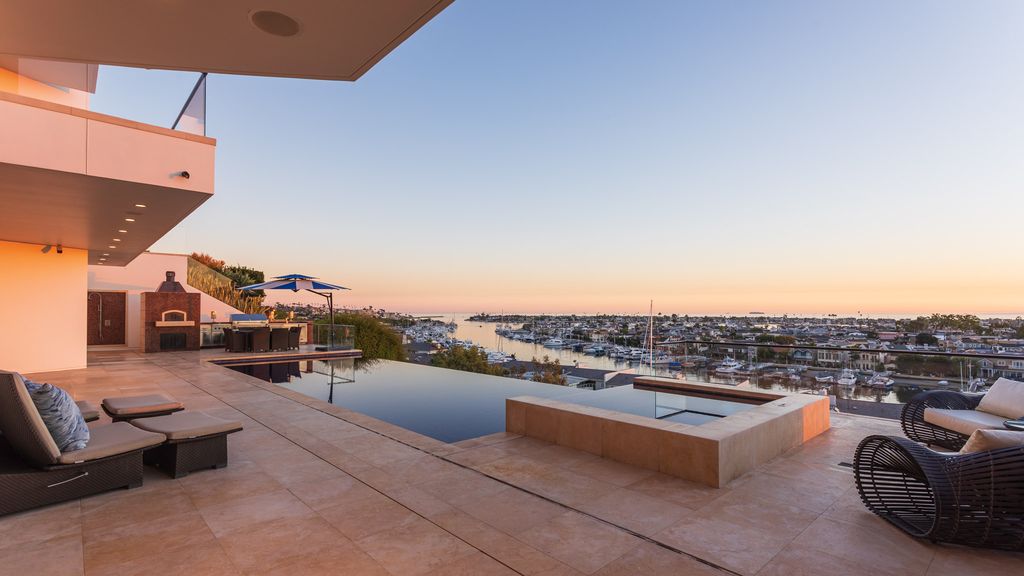 The Home in Corona Del Mar is an unparalleled design and unrivaled construction quality with explosive front-row panoramic views now available for sale. This house located at 1301 Dolphin Ter, Corona Del Mar, California