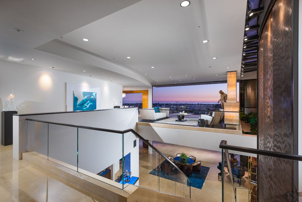 The Home in Corona Del Mar is an unparalleled design and unrivaled construction quality with explosive front-row panoramic views now available for sale. This house located at 1301 Dolphin Ter, Corona Del Mar, California