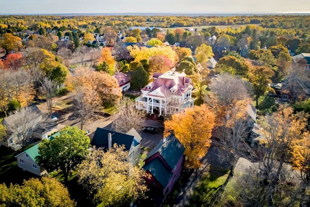 The Home in Michigan is a luxurious home currently being operated as a turn-key bed & breakfast vacation retreat now available for sale. This home located at 320 Tamarack St, Laurium, Michigan; offering 36 bedrooms and 11 bathrooms with 37,880 square feet of living spaces.