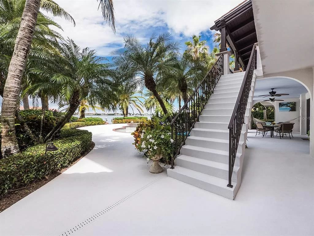 The Florida Home is perfectly perched on two lots overlooking Anna Maria Sound with expansive water and sunset views throughout now available for sale. This home located at 12925 42nd Ter W, Cortez, Florida