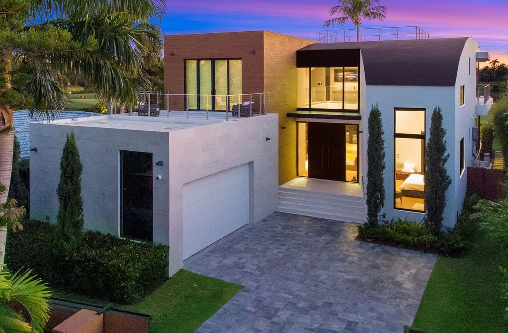 The Miami Beach Home is a new construction home located on a quiet street with direct access to the prestigious La Gorce Country Club now available for sale. This house located at 450 W 62nd St, Miami Beach, Florida