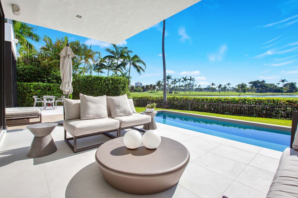 The Miami Beach Home is a new construction home located on a quiet street with direct access to the prestigious La Gorce Country Club now available for sale. This house located at 450 W 62nd St, Miami Beach, Florida
