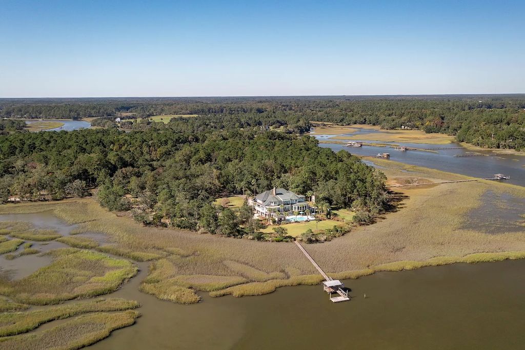 The Home in South Carolina is a luxurious home featuring the finest architecture and endless edge saltwater pool now available for sale. This home located at 4458 Park Island Rd, Meggett, South Carolina; offering 05 bedrooms and 08 bathrooms with 12,776 square feet of living spaces.