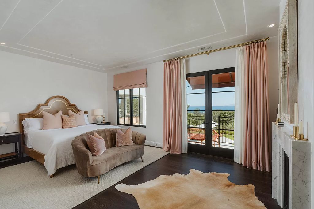 This pink bedroom is one of our favorites since it demonstrates that an exquisite space doesn't require a lot of elaborate details. Anyone entering the room will be greeted with an intimidating statement by the plain nightstand and the grand, magnificent bed frame with vintage headboard.