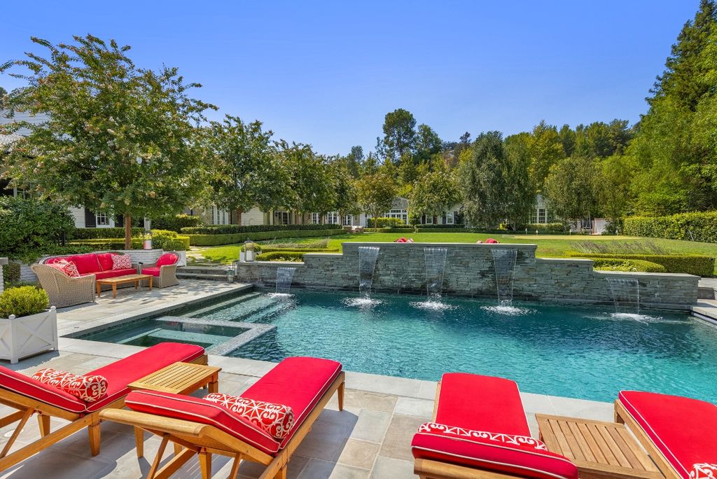 The Hidden Hills Home is a beautiful custom estate with multiple waterfalls, expansive lawn areas, putting green, lush privacy landscaping now available for sale. This home located at 5889 Jed Smith Rd, Hidden Hills, California