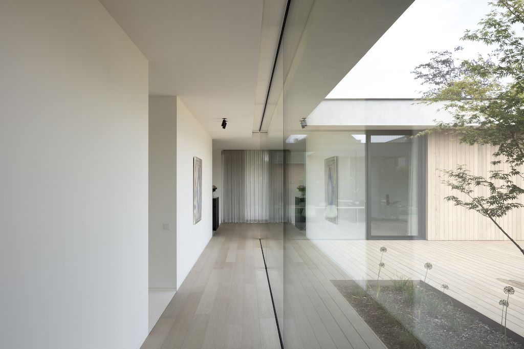 Villa Bonh, an U-shaped home in contemporary fashion by CAS architecten