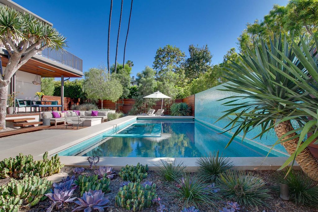 The Home in Venice is an exceptional and very private resort estate situated on one of the historic walk streets now available for sale. This home located at 805 Marco Pl, Venice, California