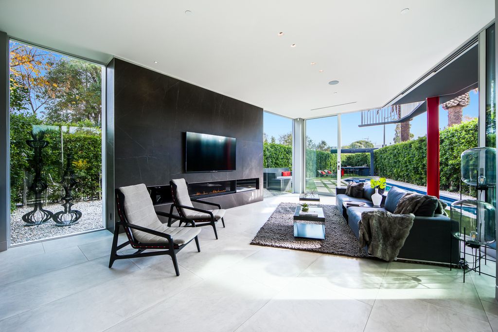 The Home in West Hollywood is a modern oasis masterfully balances cool contemporary design with lush greenery now available for sale. This house located at 417 Norwich Dr, West Hollywood, California