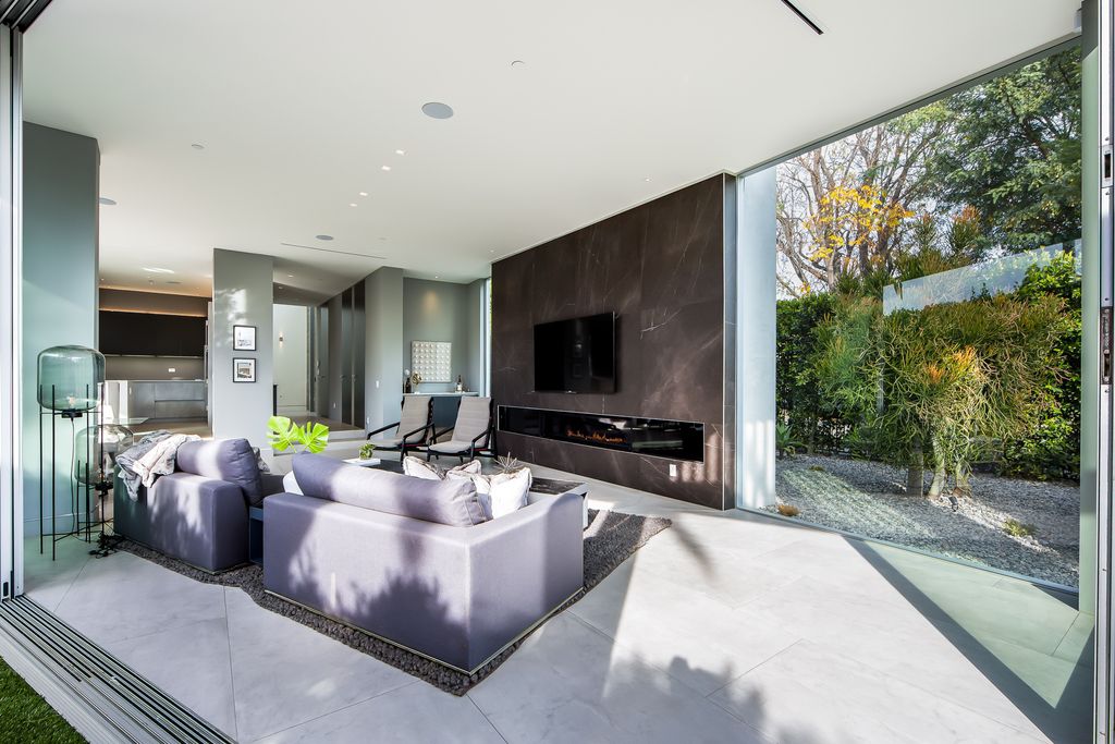 The Home in West Hollywood is a modern oasis masterfully balances cool contemporary design with lush greenery now available for sale. This house located at 417 Norwich Dr, West Hollywood, California