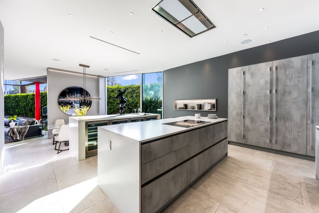 The Home in West Hollywood is a modern oasis masterfully balances cool contemporary design with lush greenery now available for sale. This house located at 417 Norwich Dr, West Hollywood, California