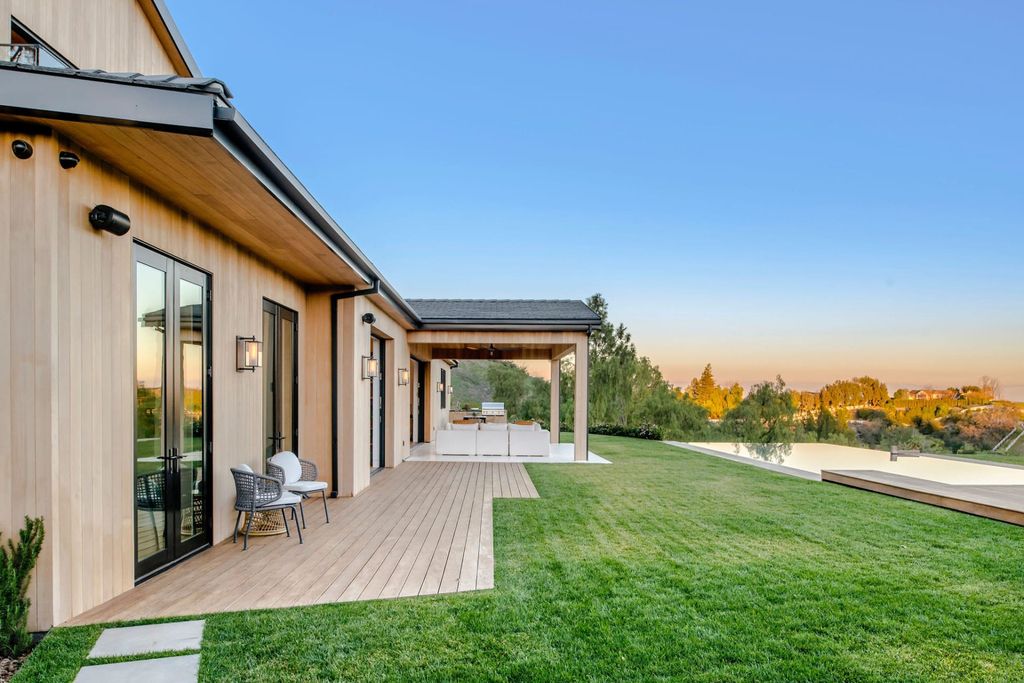 The Farmhouse in Hidden Hills is a new contemporary estate has been meticulously crafted for utmost tranquility and seclusion now available for sale. This home located at 5505 Hoback Glen Rd, Hidden Hills, California;
