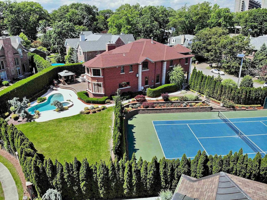 The Home in New Jersey is a luxurious home set on meticulously manicured grounds now available for sale. This home located at 2 Euclid Rd, Fort Lee, New Jersey; offering 06 bedrooms and 07 bathrooms with 6,000 square feet of living spaces. 