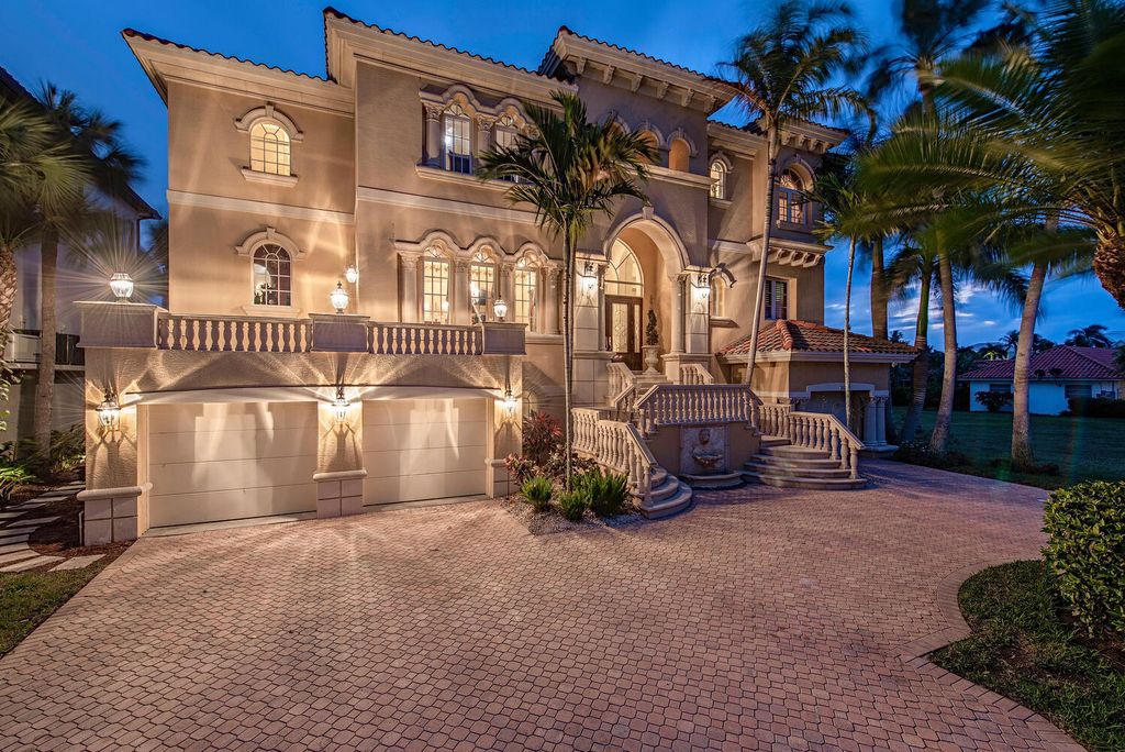 The Home in Naples is a privately situated custom Gulf access estate has a circular paver driveway and mature lush landscaping now available for sale. This home located at 160 Seabreeze Ave, Naples, Florida