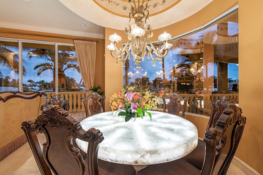 The Home in Naples is a privately situated custom Gulf access estate has a circular paver driveway and mature lush landscaping now available for sale. This home located at 160 Seabreeze Ave, Naples, Florida
