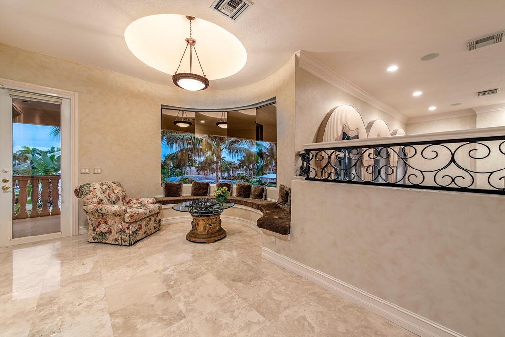 The Home in Naples is a privately situated custom Gulf access estate has a circular paver driveway and mature lush landscaping now available for sale. This home located at 160 Seabreeze Ave, Naples, Florida