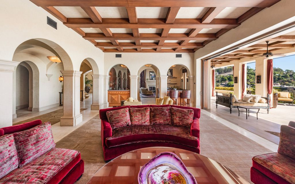 The Beverly Hills Estate is ultra-private palatial masterpiece is set behind large double gates with a stone motor court now available for rent. This home located at 10066 Cielo Dr, Beverly Hills, California