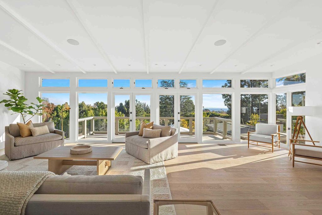 The Home in Pacific Palisades is a fully-remodeled estate provides an open floor plan and huge windows with a wide view of Santa Monica Bay and city lights now available for sale. This home located at 1514 Sorrento Dr, Pacific Palisades, California