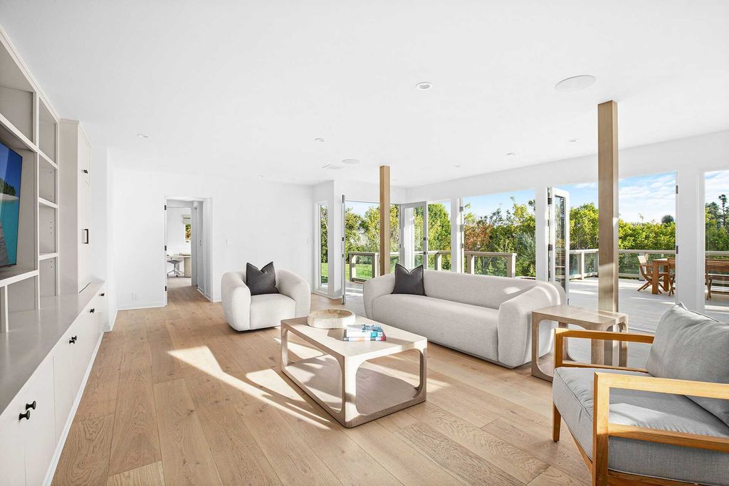 The Home in Pacific Palisades is a fully-remodeled estate provides an open floor plan and huge windows with a wide view of Santa Monica Bay and city lights now available for sale. This home located at 1514 Sorrento Dr, Pacific Palisades, California
