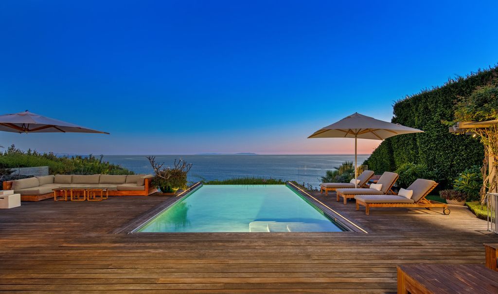 The Malibu Home is a Point Dume mid-century modern estate commands spectacular ocean and Catalina Island views now available for sale. This home located at 29060 Cliffside Dr, Malibu, California