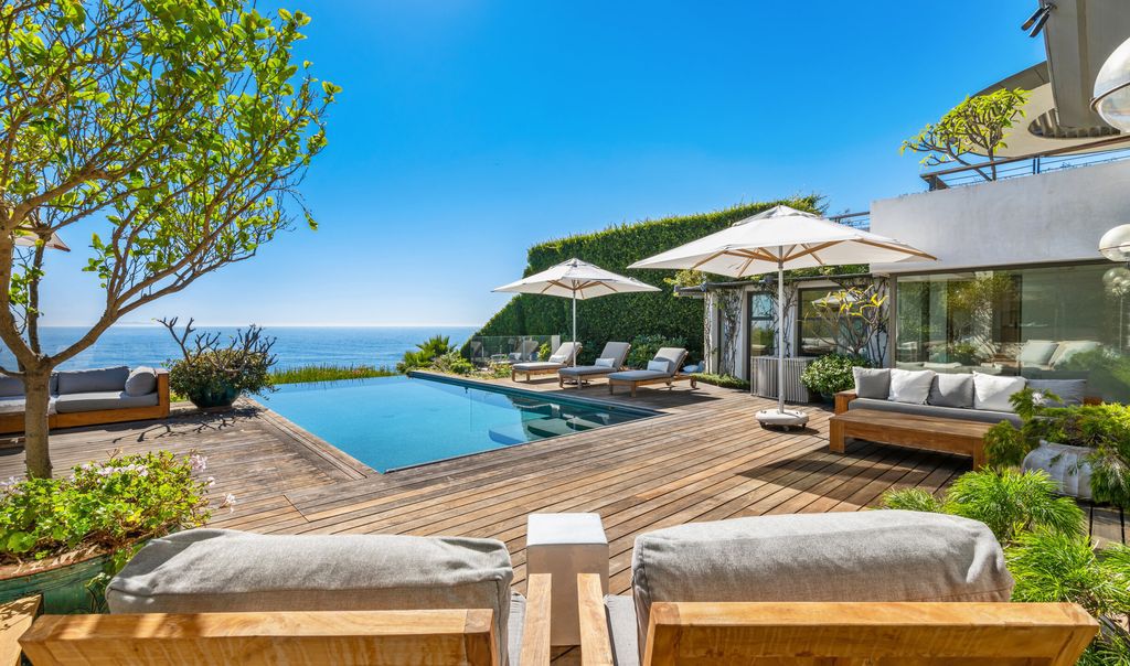 The Malibu Home is a Point Dume mid-century modern estate commands spectacular ocean and Catalina Island views now available for sale. This home located at 29060 Cliffside Dr, Malibu, California