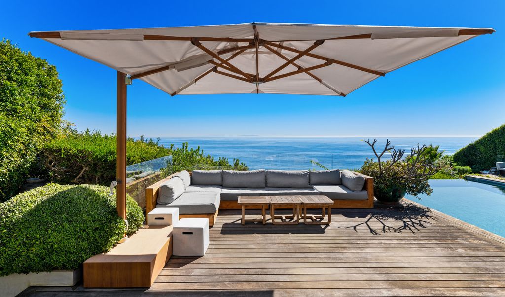 The Malibu Home is a Point Dume mid-century modern estate commands spectacular ocean and Catalina Island views now available for sale. This home located at 29060 Cliffside Dr, Malibu, California