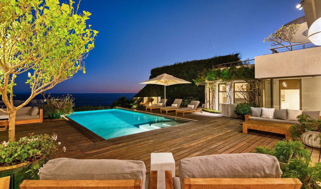 The Malibu Home is a Point Dume mid-century modern estate commands spectacular ocean and Catalina Island views now available for sale. This home located at 29060 Cliffside Dr, Malibu, California