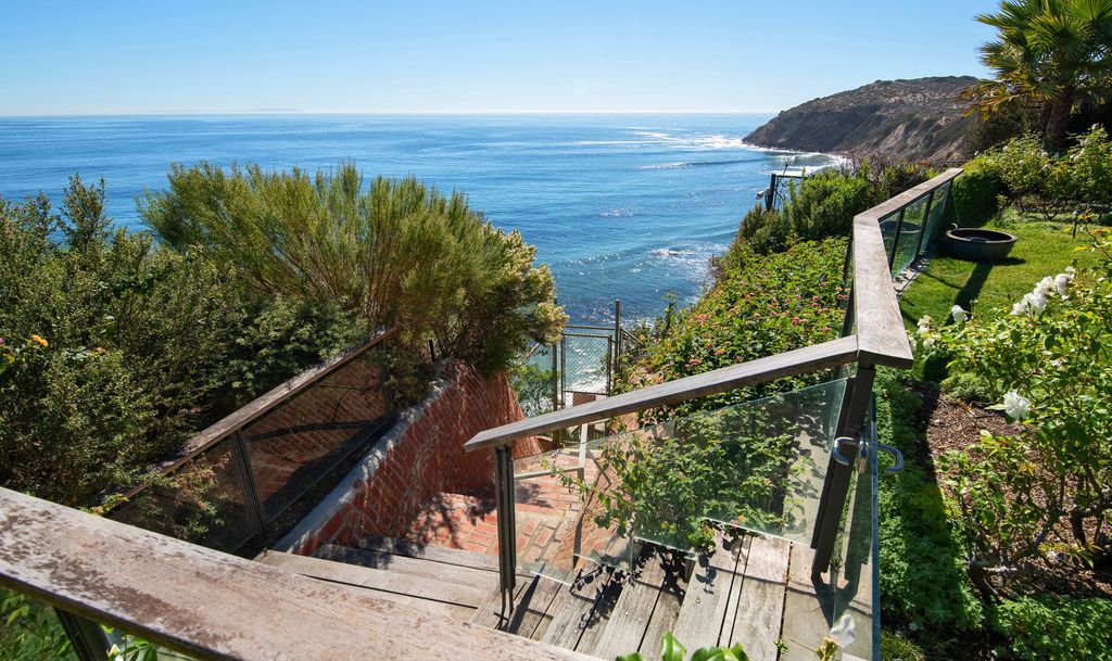 The Malibu Home is a Point Dume mid-century modern estate commands spectacular ocean and Catalina Island views now available for sale. This home located at 29060 Cliffside Dr, Malibu, California