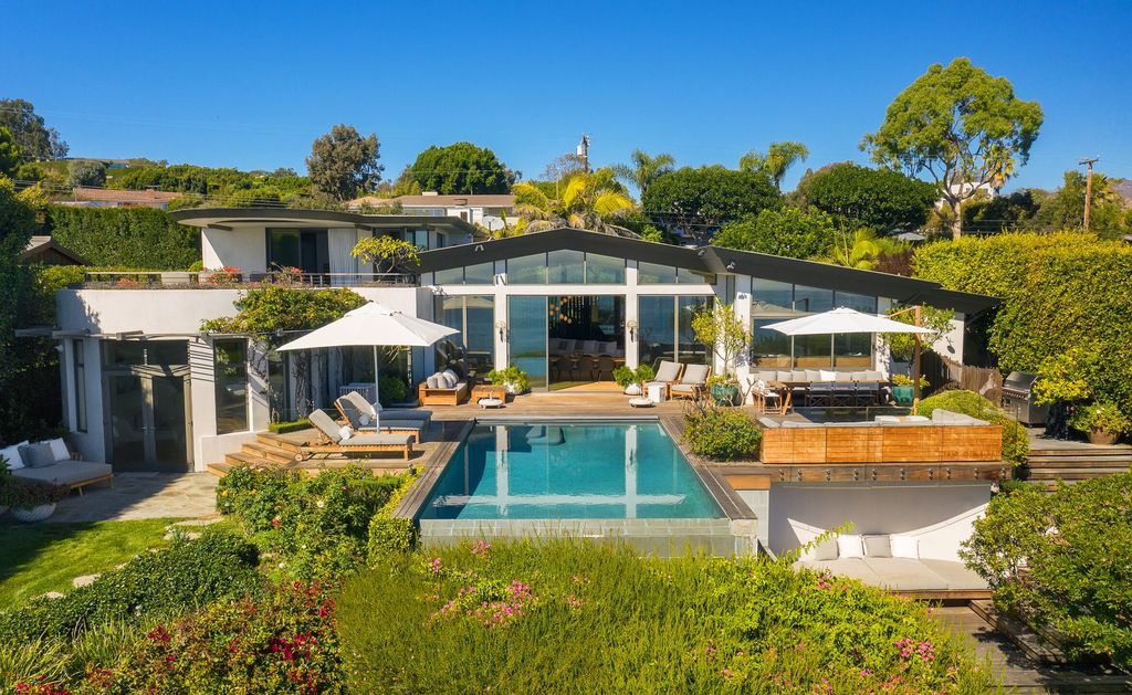 The Malibu Home is a Point Dume mid-century modern estate commands spectacular ocean and Catalina Island views now available for sale. This home located at 29060 Cliffside Dr, Malibu, California