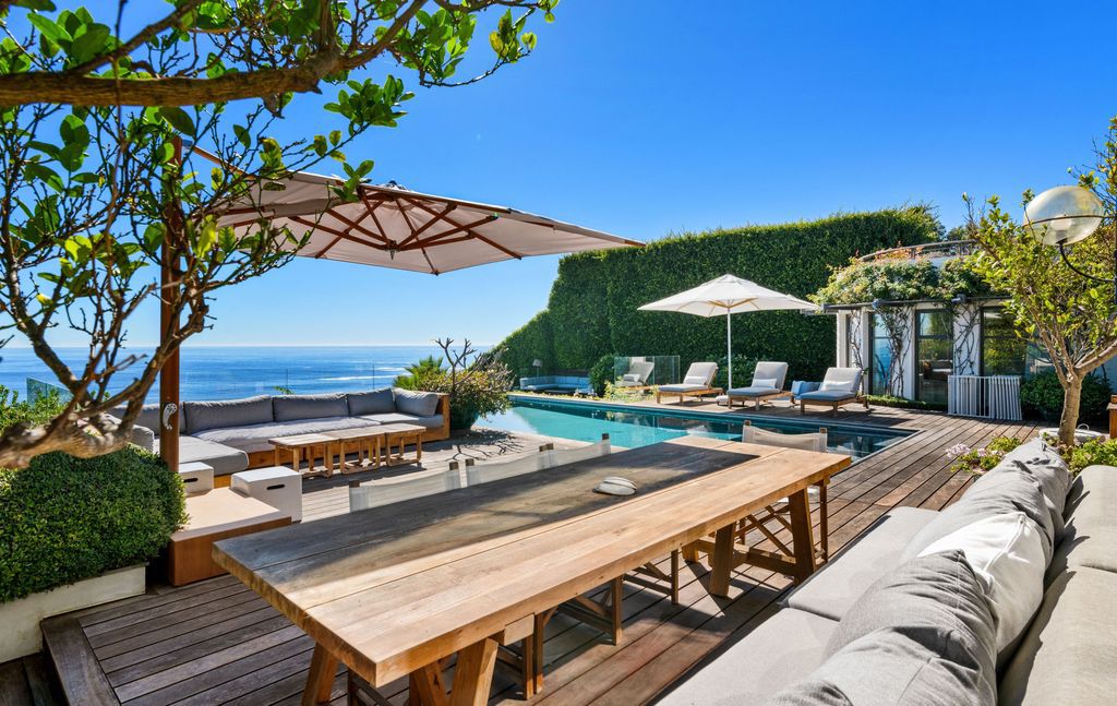 The Malibu Home is a Point Dume mid-century modern estate commands spectacular ocean and Catalina Island views now available for sale. This home located at 29060 Cliffside Dr, Malibu, California