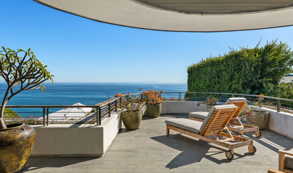 The Malibu Home is a Point Dume mid-century modern estate commands spectacular ocean and Catalina Island views now available for sale. This home located at 29060 Cliffside Dr, Malibu, California