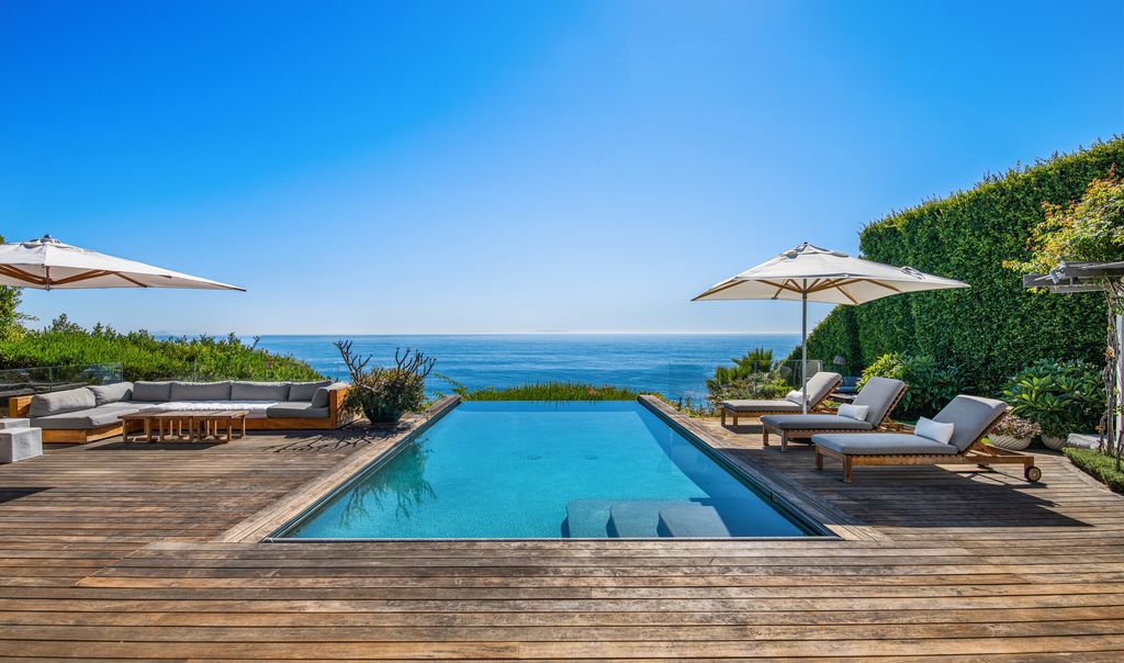 The Malibu Home is a Point Dume mid-century modern estate commands spectacular ocean and Catalina Island views now available for sale. This home located at 29060 Cliffside Dr, Malibu, California