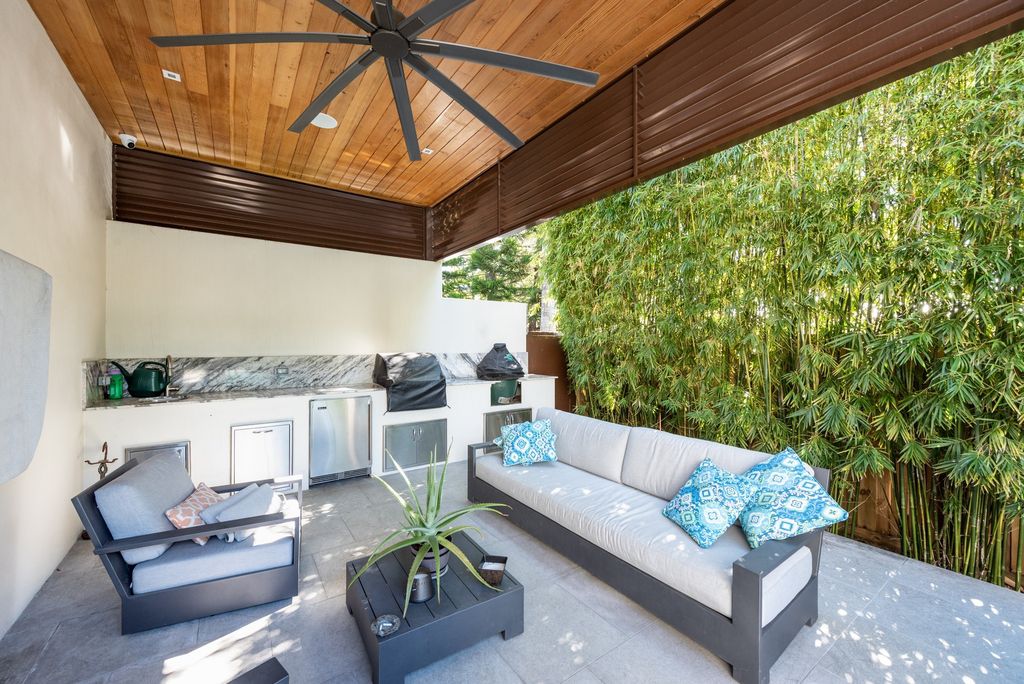 The Home in Miami Beach set on large corner lot property, built for elegance and privacy, yard faces south for sunshine all day now available for sale. This house located at 5288 Alton Rd, Miami Beach, Florida