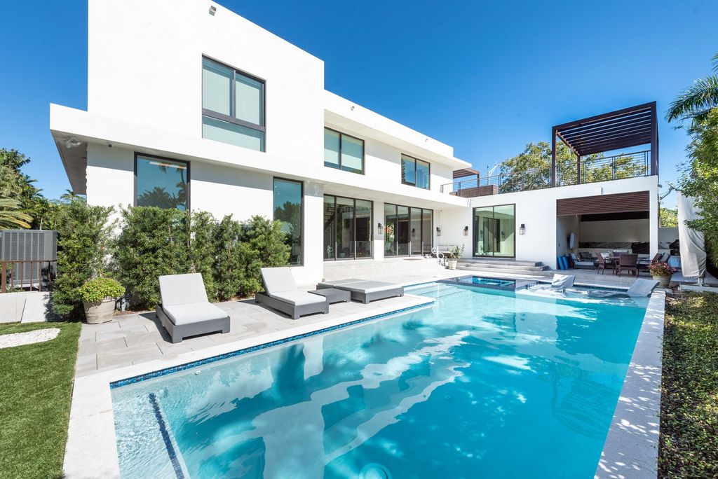 The Home in Miami Beach set on large corner lot property, built for elegance and privacy, yard faces south for sunshine all day now available for sale. This house located at 5288 Alton Rd, Miami Beach, Florida