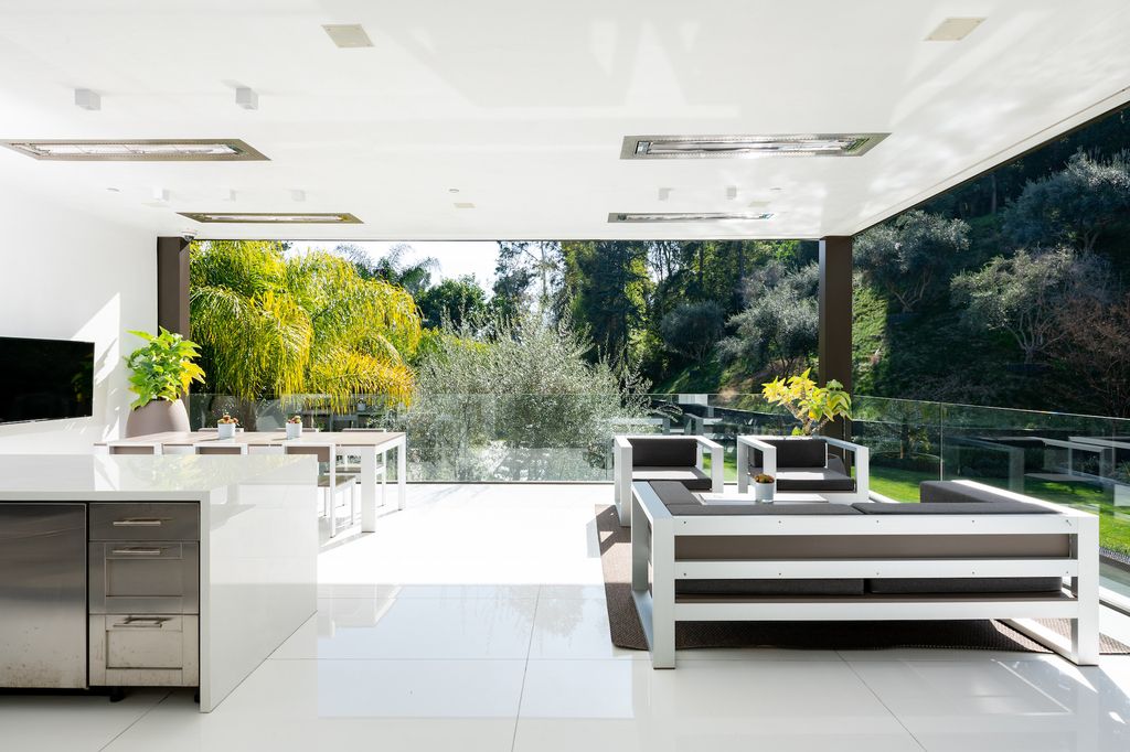The Beverly Hills Mansion is a true display of luxury showcasing 12,800 square feet of sleek design and exquisite finishes now available for sale. This home located at 1231 Lago Vista Dr, Beverly Hills, California