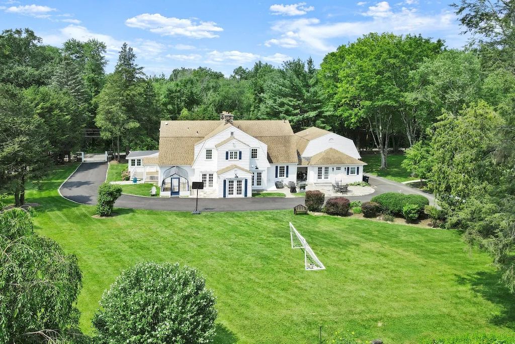 The Home in Connecticut is a luxurious home updated with an outdoor pool, a tennis court, a greenhouse and other amenities now available for sale. This home located at 849 Lake Ave, Greenwich, Connecticut; offering 05 bedrooms and 06 bathrooms with 5,221 square feet of living spaces.