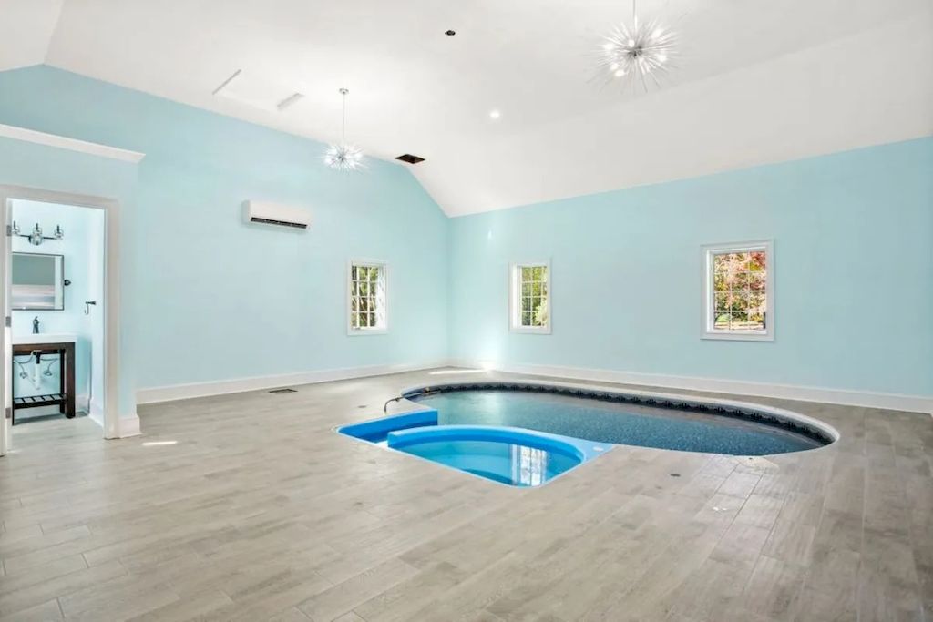 The Home in Connecticut is a luxurious home updated with an outdoor pool, a tennis court, a greenhouse and other amenities now available for sale. This home located at 849 Lake Ave, Greenwich, Connecticut; offering 05 bedrooms and 06 bathrooms with 5,221 square feet of living spaces.