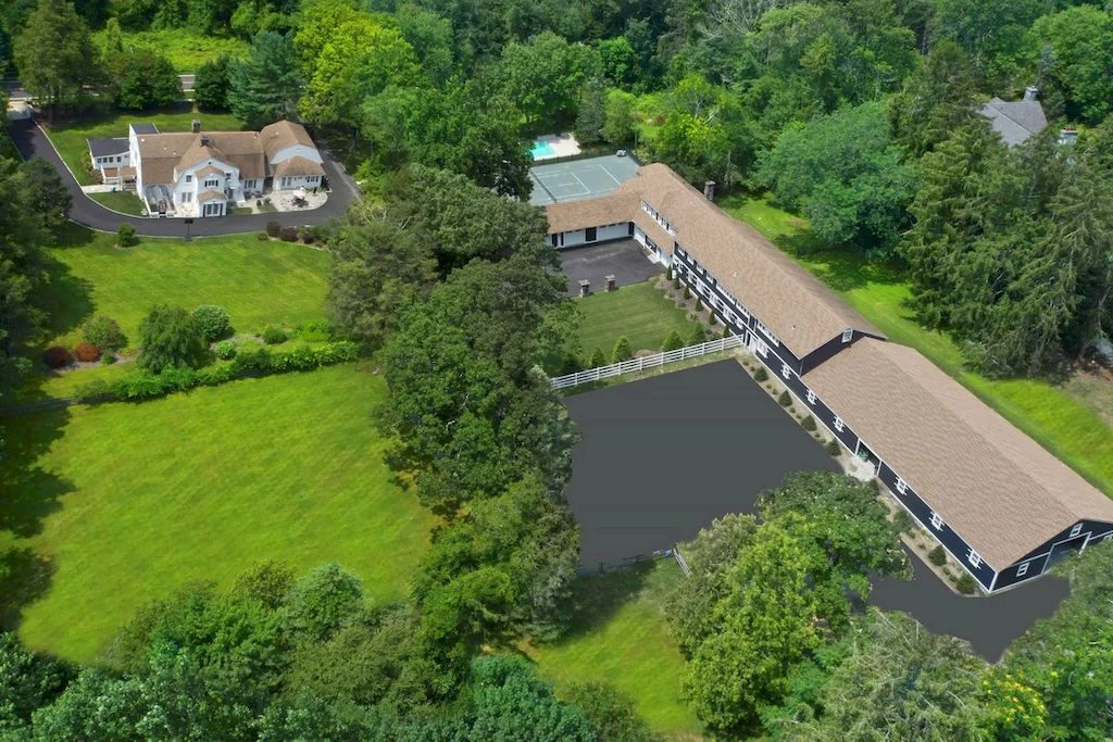 The Home in Connecticut is a luxurious home updated with an outdoor pool, a tennis court, a greenhouse and other amenities now available for sale. This home located at 849 Lake Ave, Greenwich, Connecticut; offering 05 bedrooms and 06 bathrooms with 5,221 square feet of living spaces.