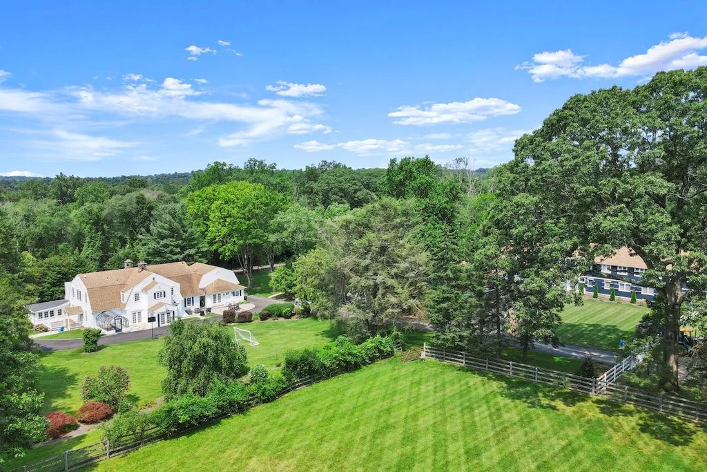 The Home in Connecticut is a luxurious home updated with an outdoor pool, a tennis court, a greenhouse and other amenities now available for sale. This home located at 849 Lake Ave, Greenwich, Connecticut; offering 05 bedrooms and 06 bathrooms with 5,221 square feet of living spaces.