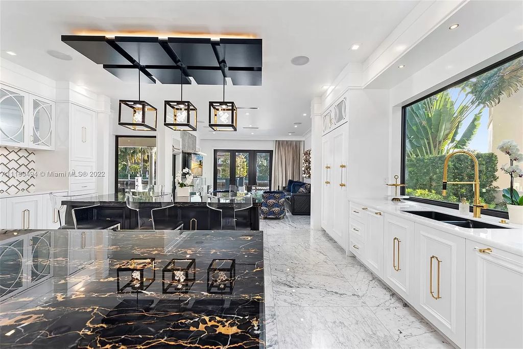 The Mansion in Fort Lauderdale is a timelessly designed home featuring a grand double height entryway and a thoughtful floorplan now available for sale. This home located at 2436 Aqua Vista Blvd, Fort Lauderdale, Florida